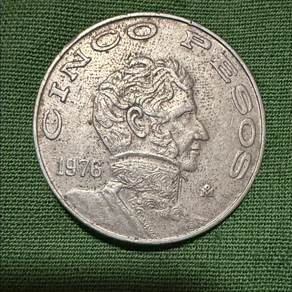 Mint Silver Tone Coin on Green Surface